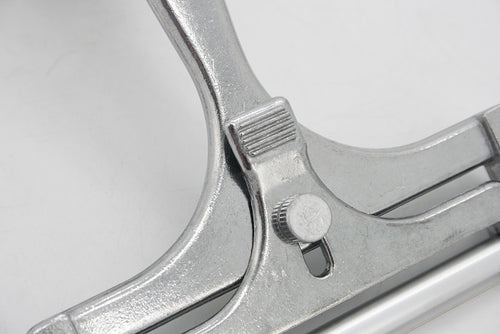 Metal tube squeezer used for efficiently squeezing out contents from tubes, such as toothpaste, paint, or ointment.